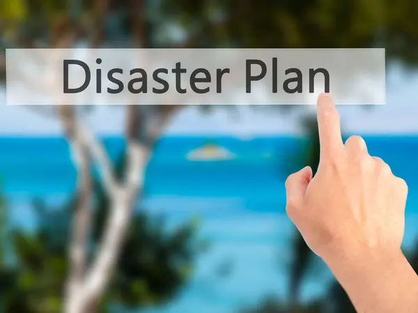 Disaster Plan - Hand pressing a button on blurred background con — Stock Photo, Image