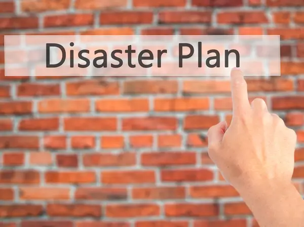 Disaster Plan - Hand pressing a button on blurred background con — Stock Photo, Image