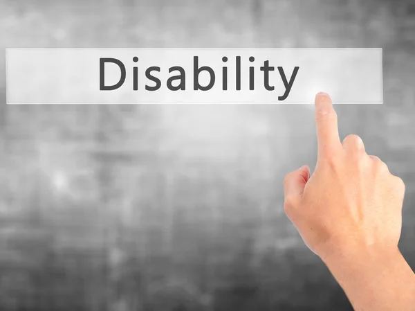 Disability - Hand pressing a button on blurred background concep — Stock Photo, Image