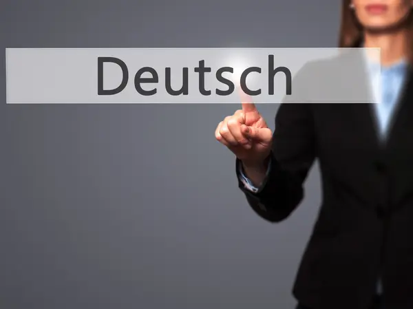 Deutsh (Немецкий по-немецки) - деловая женщина показывает пальцем на толчок — стоковое фото