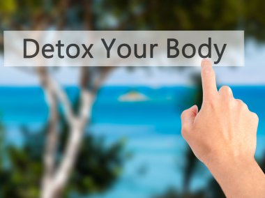 Detoks - arka plan bulanık c üzerinde bir düğmeye basarak el