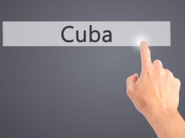 Küba - v arka plan bulanık kavramı üzerinde bir düğmeye basarak el