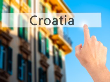 Hırvatistan - arka plan bulanık kavramı o üzerinde bir düğmeye basarak el