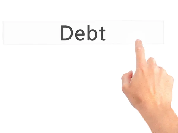 Dívida - Mão pressionando um botão no conceito de fundo borrado em v — Fotografia de Stock