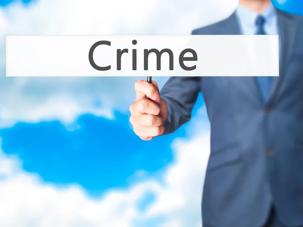 Przestępczość - człowiek biznesu Wyświetlono znak — Zdjęcie stockowe