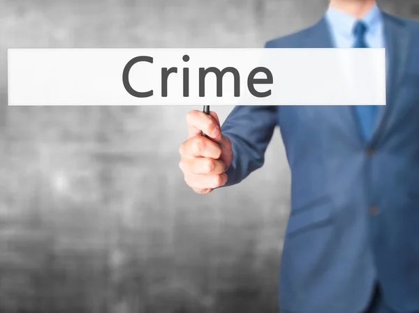 Przestępczość - człowiek biznesu Wyświetlono znak — Zdjęcie stockowe