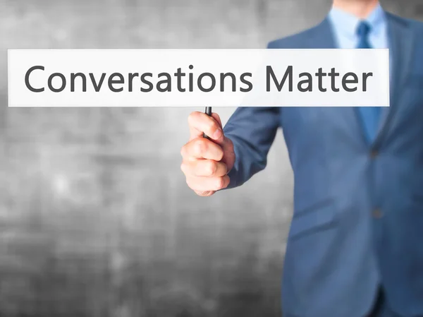 Conversations Matter - Business man showing sign — Stock Photo, Image