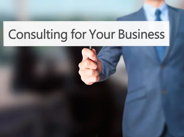 Consulting voor uw bedrijf - Business man teken tonen — Stockfoto