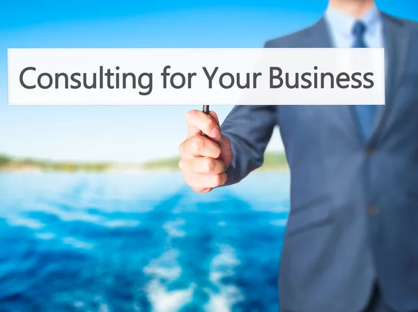 Consulting voor uw bedrijf - Business man teken tonen — Stockfoto