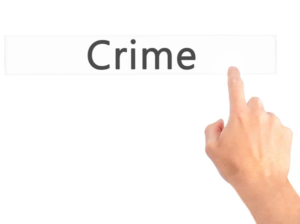 Crime - Hand pressing a button on blurred background concept on — Stock Photo, Image