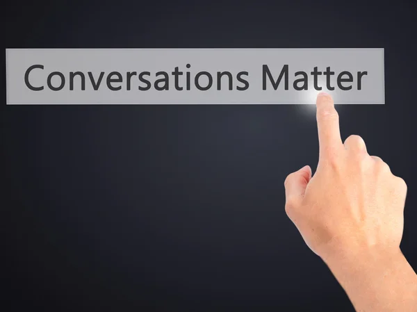 Conversations Matter - Hand pressing a button on blurred backgro — Stock Photo, Image