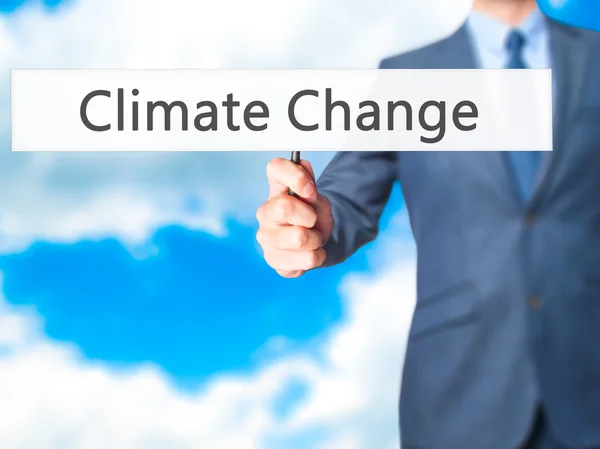 Climate Change - Business man showing sign — Stock Photo, Image