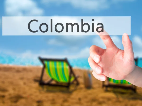Колумбия - Ручное нажатие кнопки на размытом фоне — стоковое фото