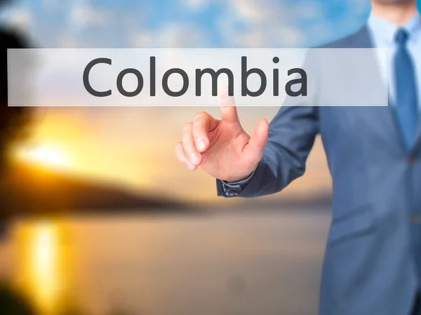 Kolumbia - Liikemies klikkaa virtuaalista kosketusnäyttöä . — kuvapankkivalokuva