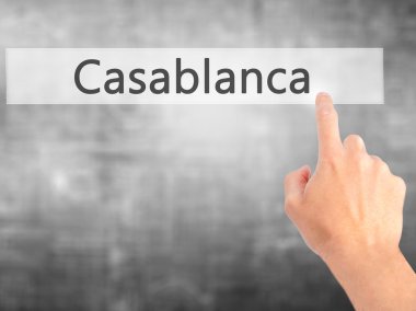 Casablanca - arka plan bulanık concep üzerinde bir düğmeye basarak el