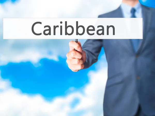 Caribbean - Business man showing sign — Stock Photo, Image