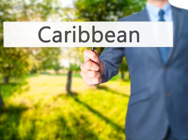 Karaibów - człowiek biznesu Wyświetlono znak — Zdjęcie stockowe