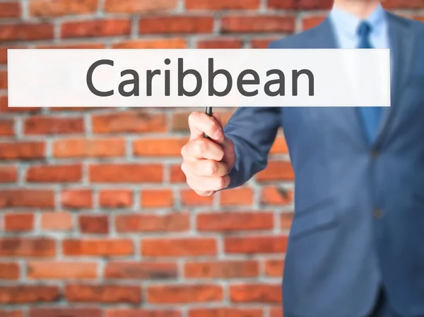 Caribbean - Business man showing sign — Stock Photo, Image