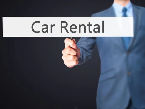 Car Rental - Business man showing sign — Stock Photo, Image