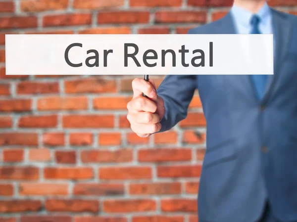 Car Rental - Business man showing sign — Stock Photo, Image