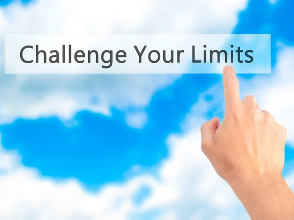 Challenge Your Limits - Hand pressing a button on blurred backgr — Stock Photo, Image