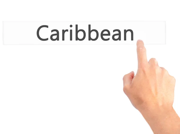 カリブ海 - ぼやけた背景の概念上のボタンを押す手 — ストック写真
