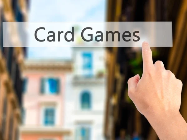 Card Games - Hand pressing a button on blurred background concep — Stock Photo, Image