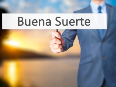 Buena Suerte İspanyolca (iyi şanslar) - işaret gösteren iş adamı