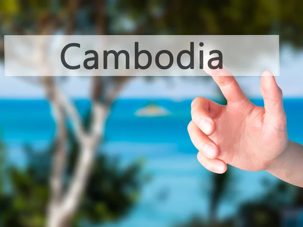 Camboya - Mano presionando un botón sobre el concepto de fondo borroso —  Fotos de Stock