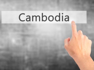 Kamboçya - arka plan bulanık kavramı üzerinde bir düğmeye basarak el 