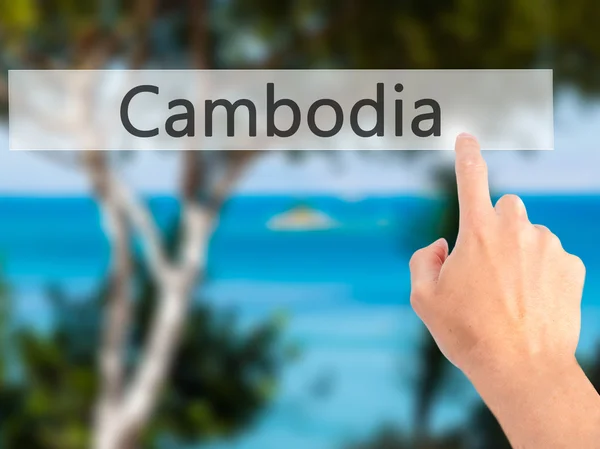 Καμπότζη - χέρι πιέζοντας ένα κουμπί στην έννοια θολή φόντο — Φωτογραφία Αρχείου