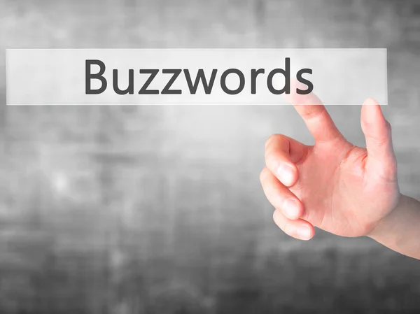 Buzzwords - Mano presionando un botón en el concepto de fondo borroso — Foto de Stock