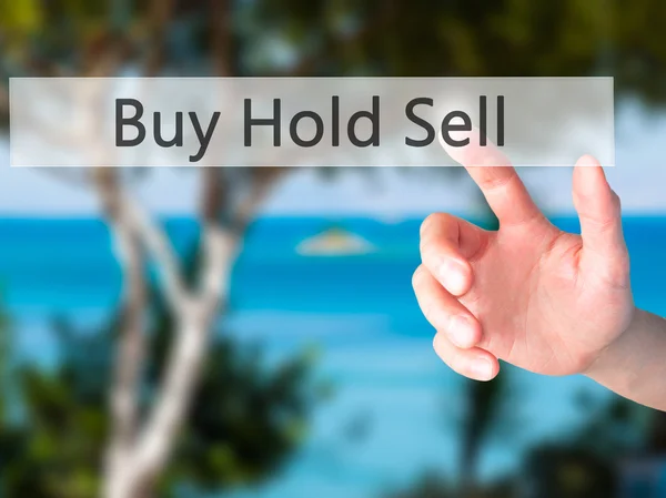 Kup Sprzedaj Hold - ręcznie naciskając przycisk na con niewyraźne tło — Zdjęcie stockowe
