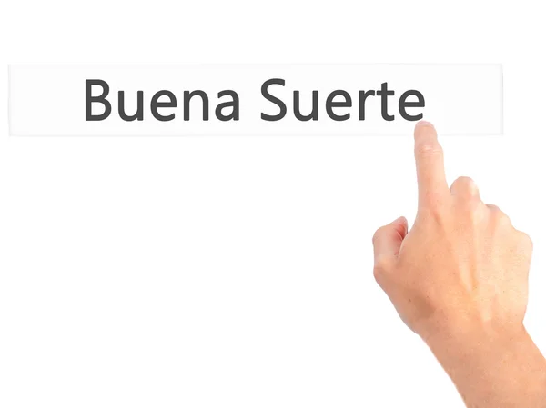 Буена Suerte (удачі на іспанській мові) - рукою, натисненням кнопки — стокове фото