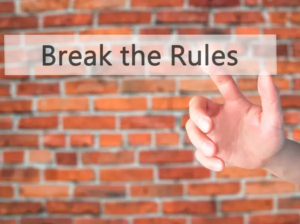 Break the Rules - Hand pressing a button on blurred background c — Stock Photo, Image
