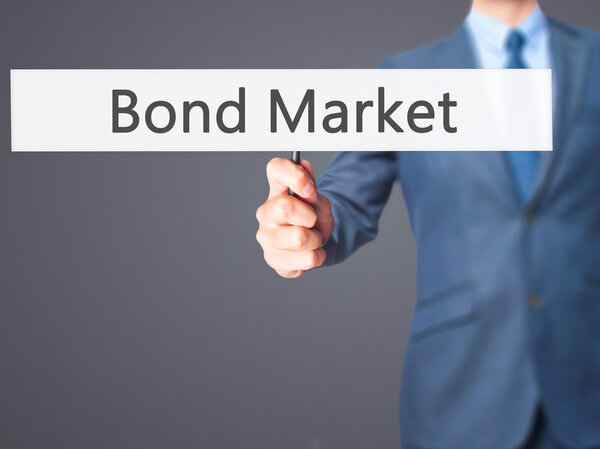 Bond Market - Businessman hand holding sign