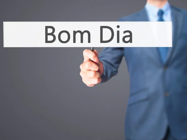 Bom Dia (i portugis - god morgon) - affärsman hand holdin — Stockfoto