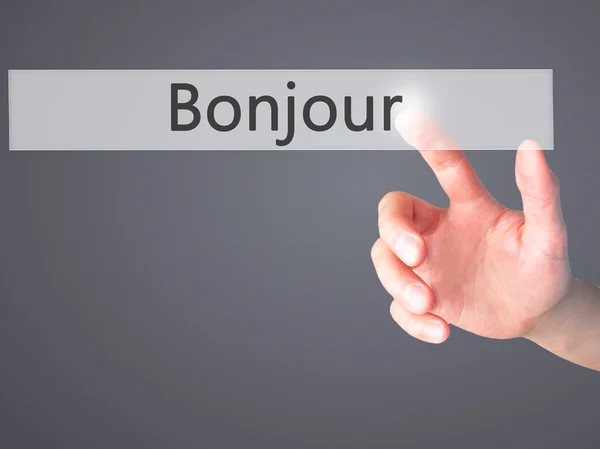 ボンジュール(フランス語でおはようございます) - ブルーのボタンを押す手 — ストック写真