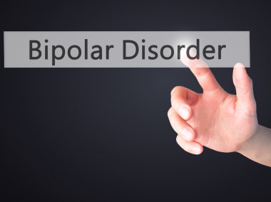 Bipolar Bozukluk - El bulanık arka plan üzerinde bir düğmeye basarak 