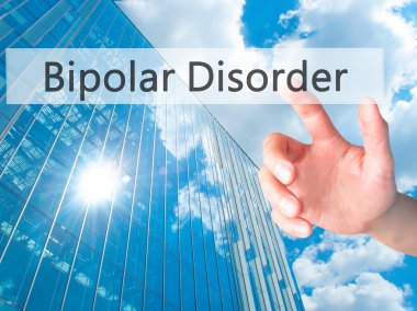Bipolar Bozukluk - El bulanık arka plan üzerinde bir düğmeye basarak 