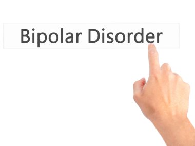 Bipolar Bozukluk - El bulanık arka plan üzerinde bir düğmeye basarak 