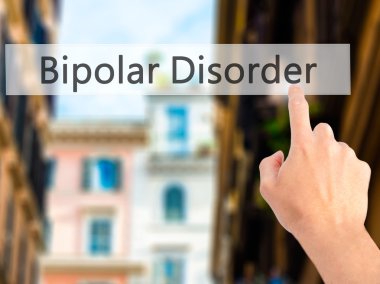 Bipolar Bozukluk - El bulanık arka plan üzerinde bir düğmeye basarak 