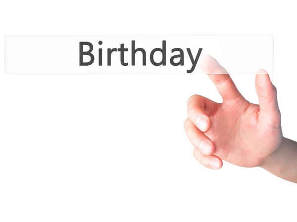 誕生日 - ぼやけた背景の概念上のボタンを押す手 — ストック写真