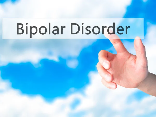 Trastorno bipolar - Mano presionando un botón sobre fondo borroso — Foto de Stock