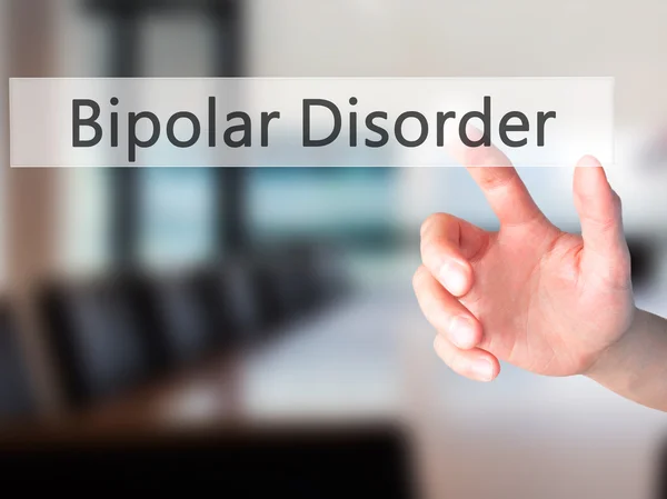 Trastorno bipolar - Mano presionando un botón sobre fondo borroso — Foto de Stock