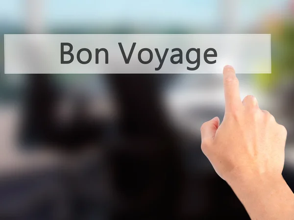 Bon Voyage (Have a Good Trip In French) - Hand pressing a button — Stock Photo, Image