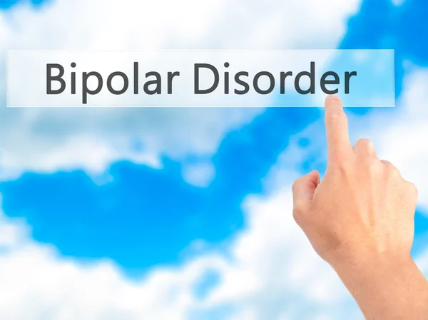 Transtorno bipolar - Mão pressionando um botão no fundo embaçado — Fotografia de Stock