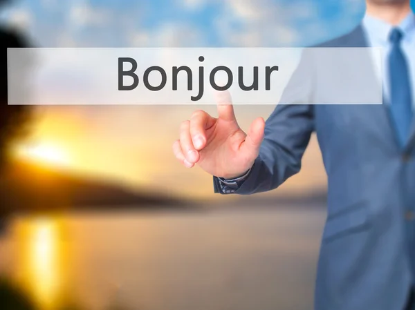 Bonjour (Good Morning in French) - Businessman hand touch  butto — Stock Photo, Image