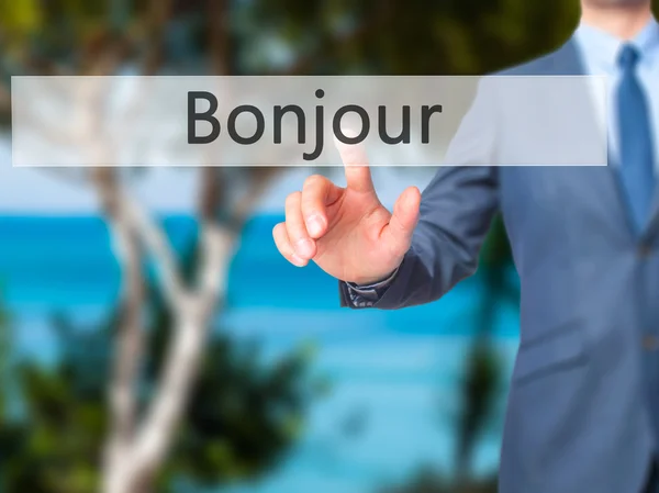 Bonjour (Good Morning in French) - Businessman hand touch  butto — Stock Photo, Image