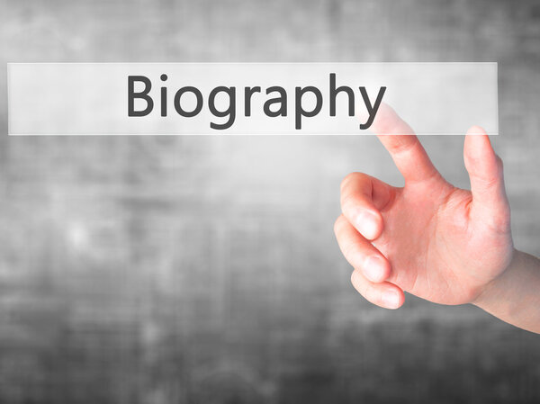 Биография - нажатие кнопки на размытом фоне
